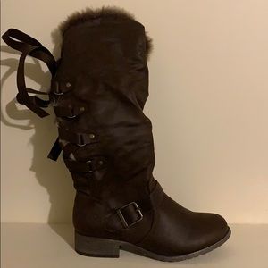 Brown boots with a tie in the back